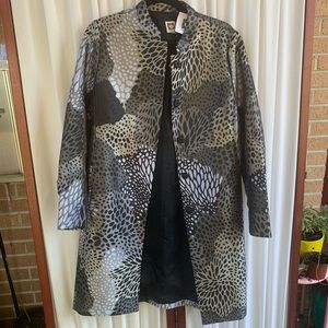 Gorgeous coat. Unique fun fabric but neutral!